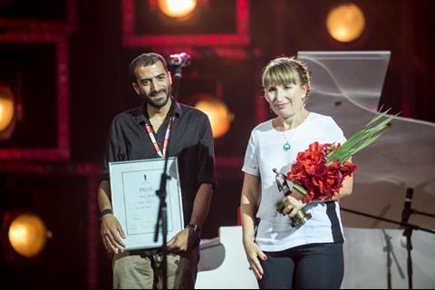 Blind Dates actor Andro Sakvarelidze and producer Olena Yershova accept Best Film award